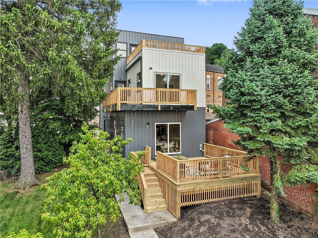 Rear elevation — tiered decks to the yard