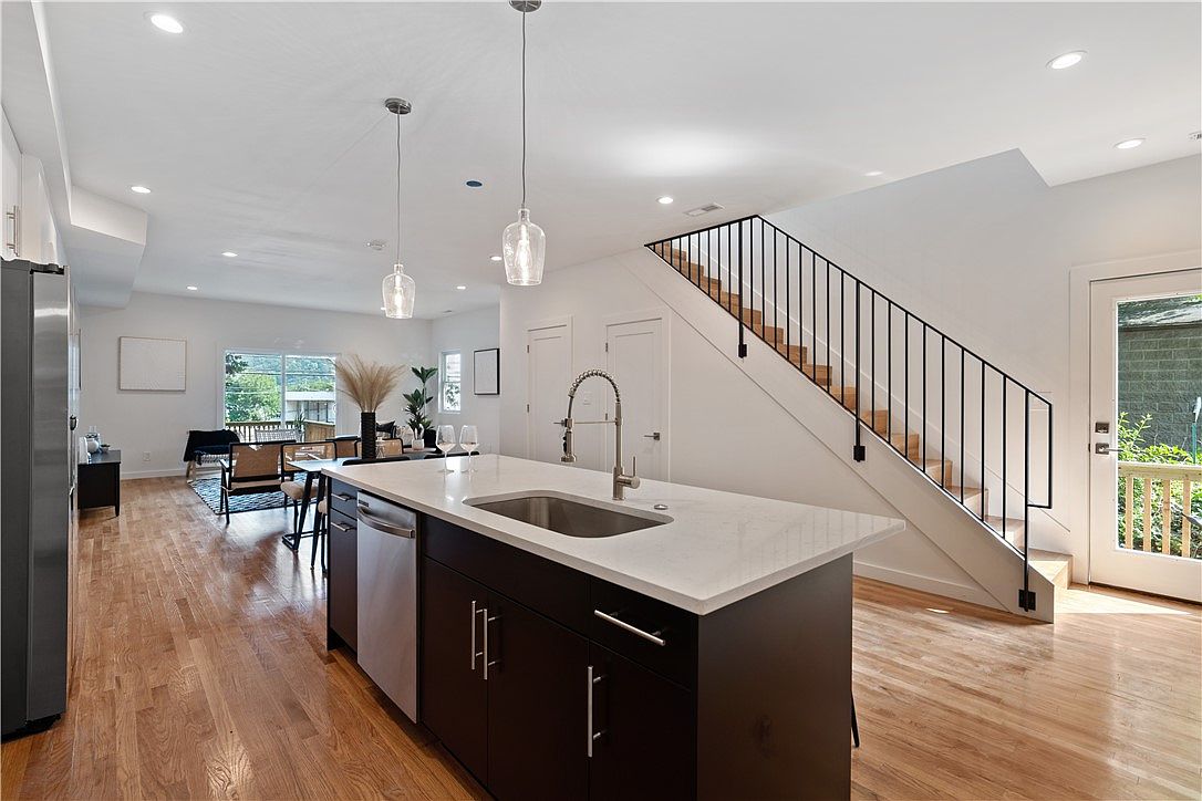Kitchen, dining, and open stair