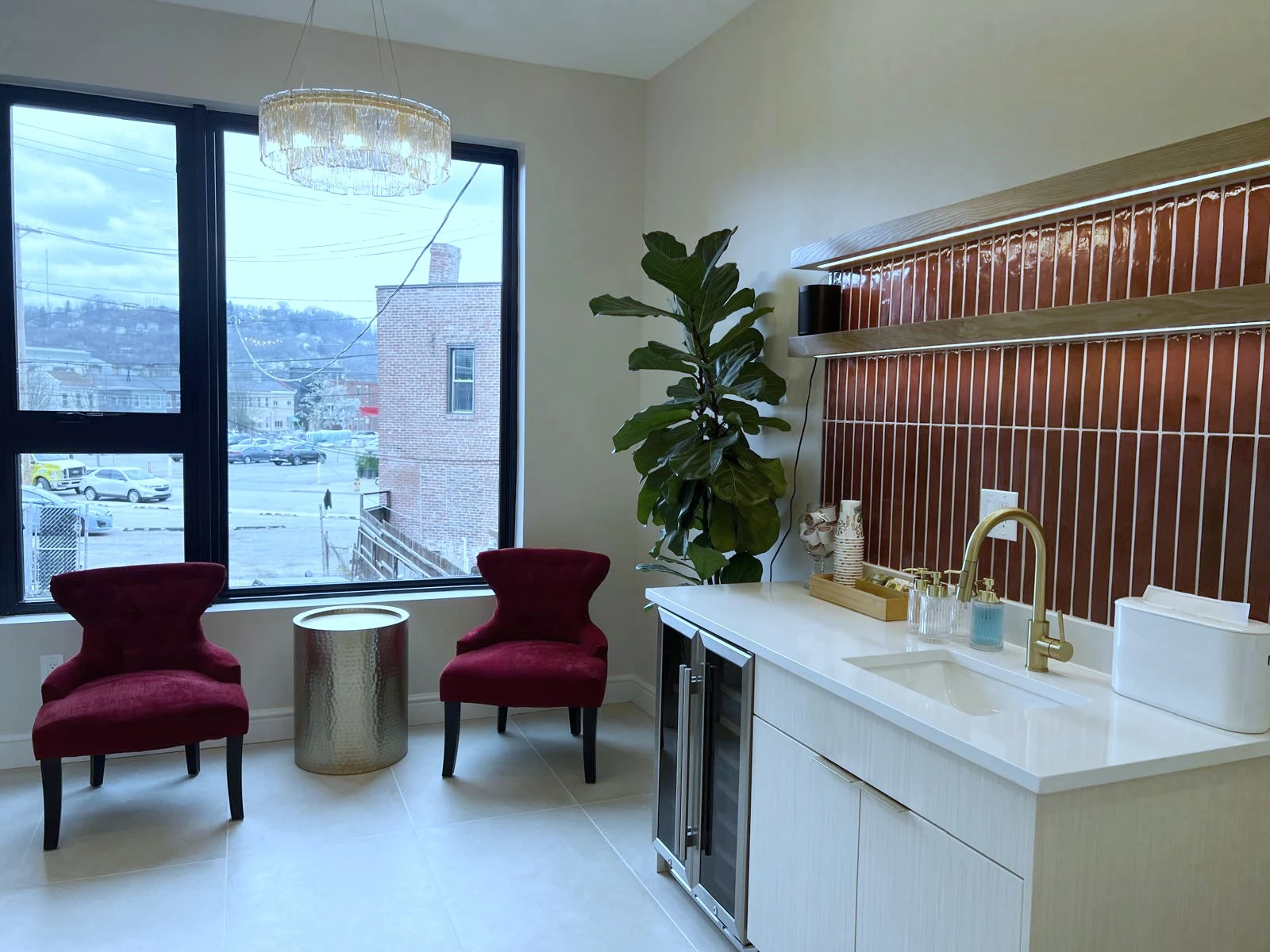 Polished front-of-house waiting area with custom feature wall in a Pittsburgh commercial fit-out