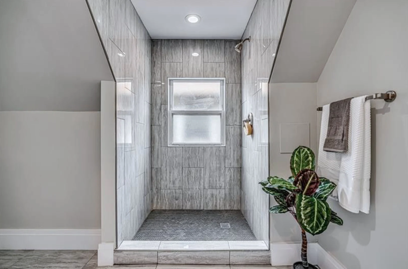 Master bath — glass-enclosed shower with original privacy window