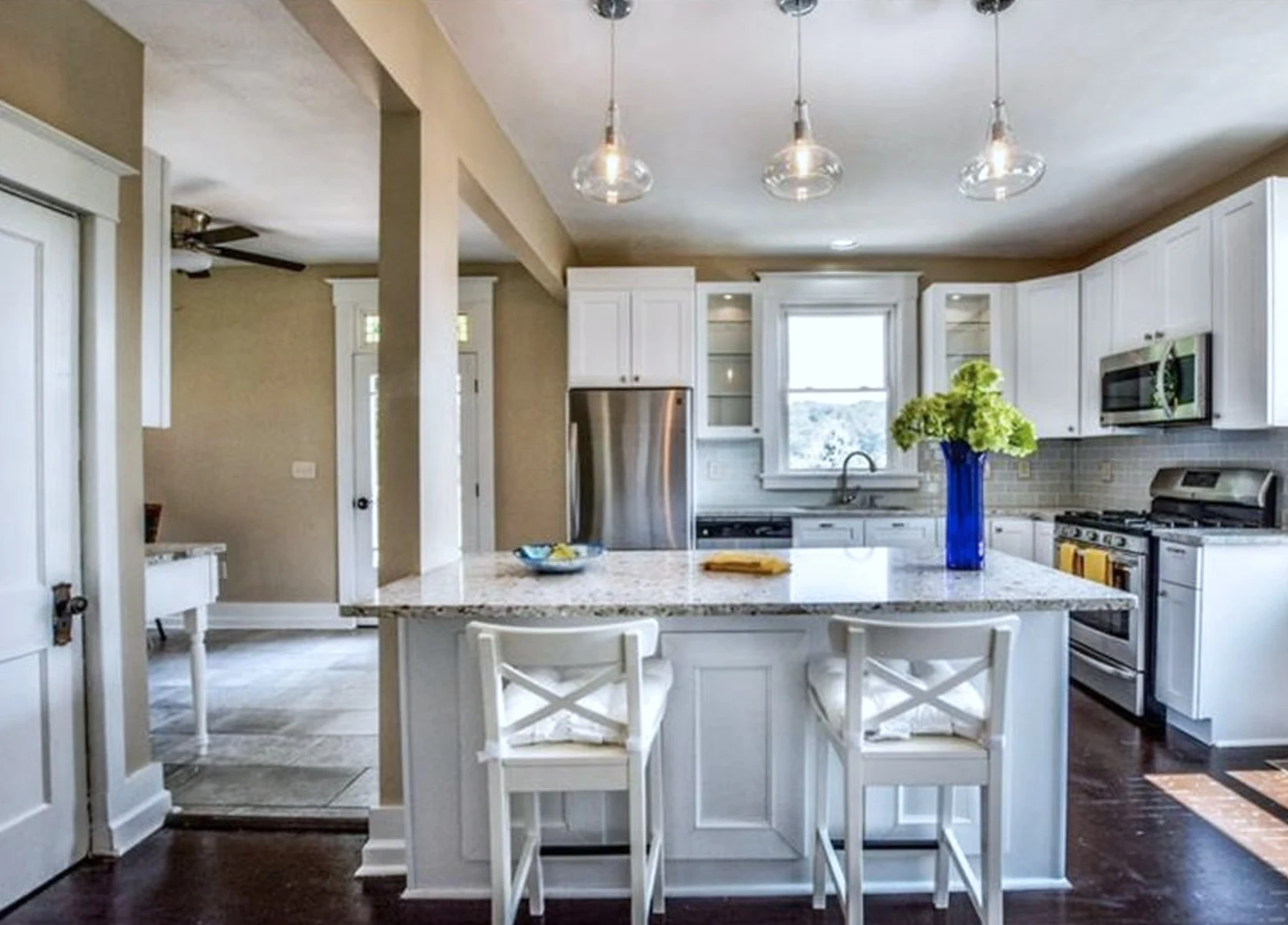 Kitchen — granite island and glass pendant lighting