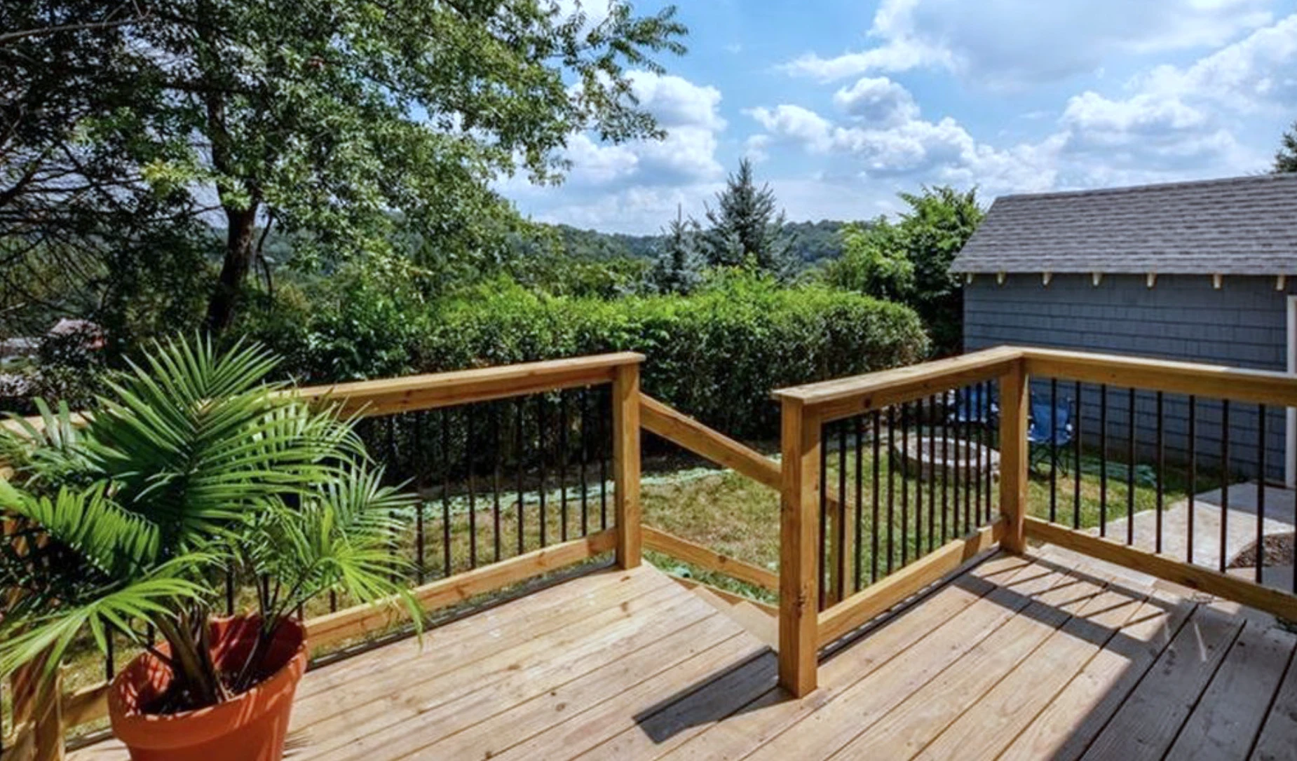 New back deck — hilltop view of the North Side tree line