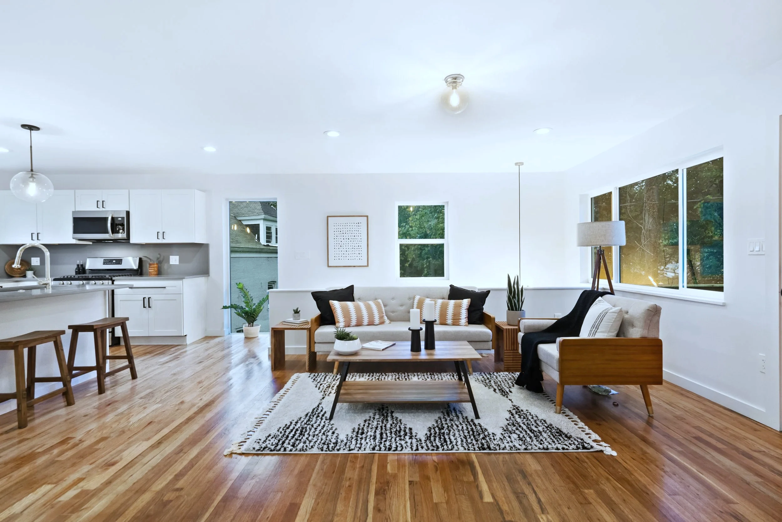 Open kitchen-living-dining plate — one continuous floor in one direction
