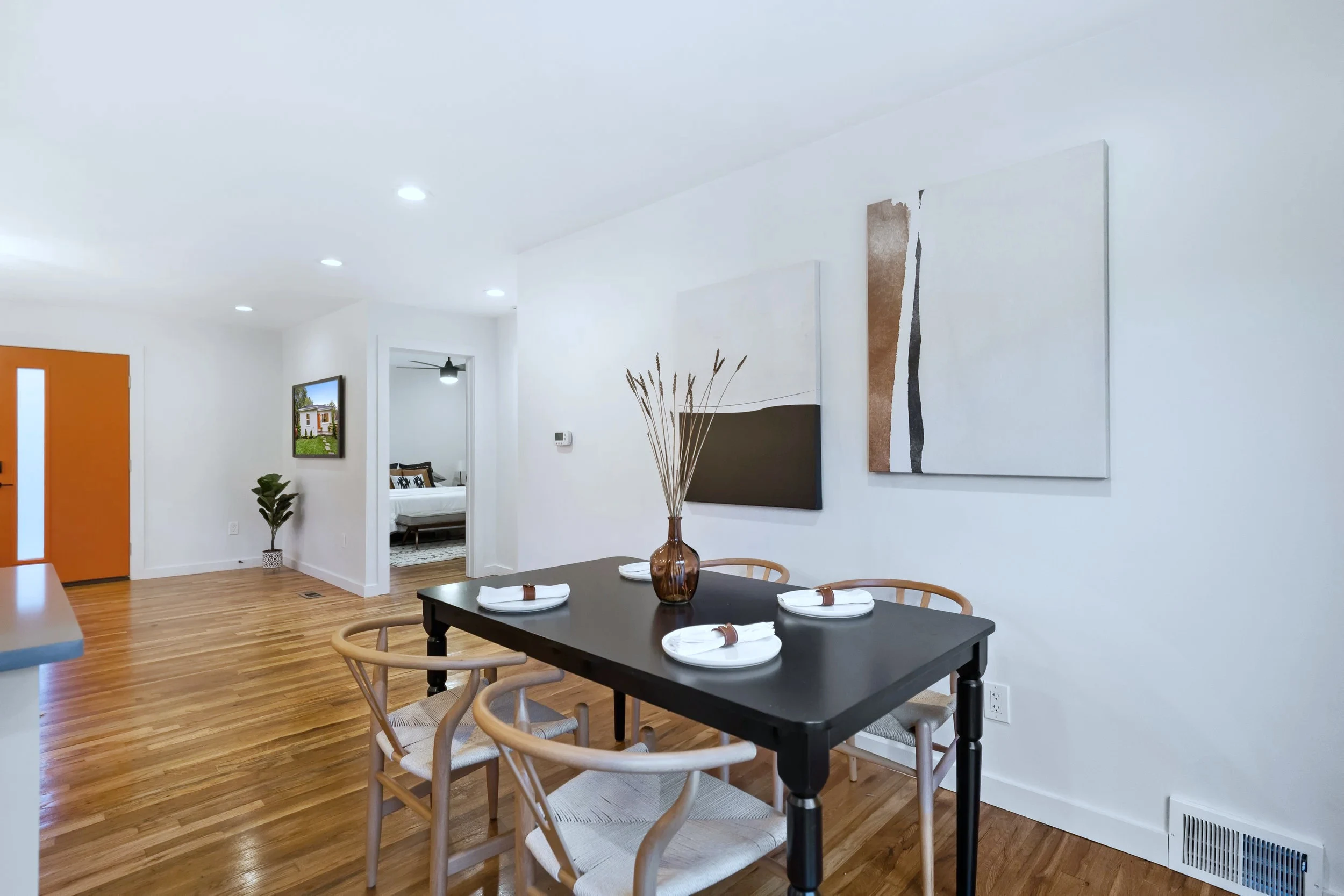 Kitchen wide angle &mdash; gray-quartz island and globe pendants