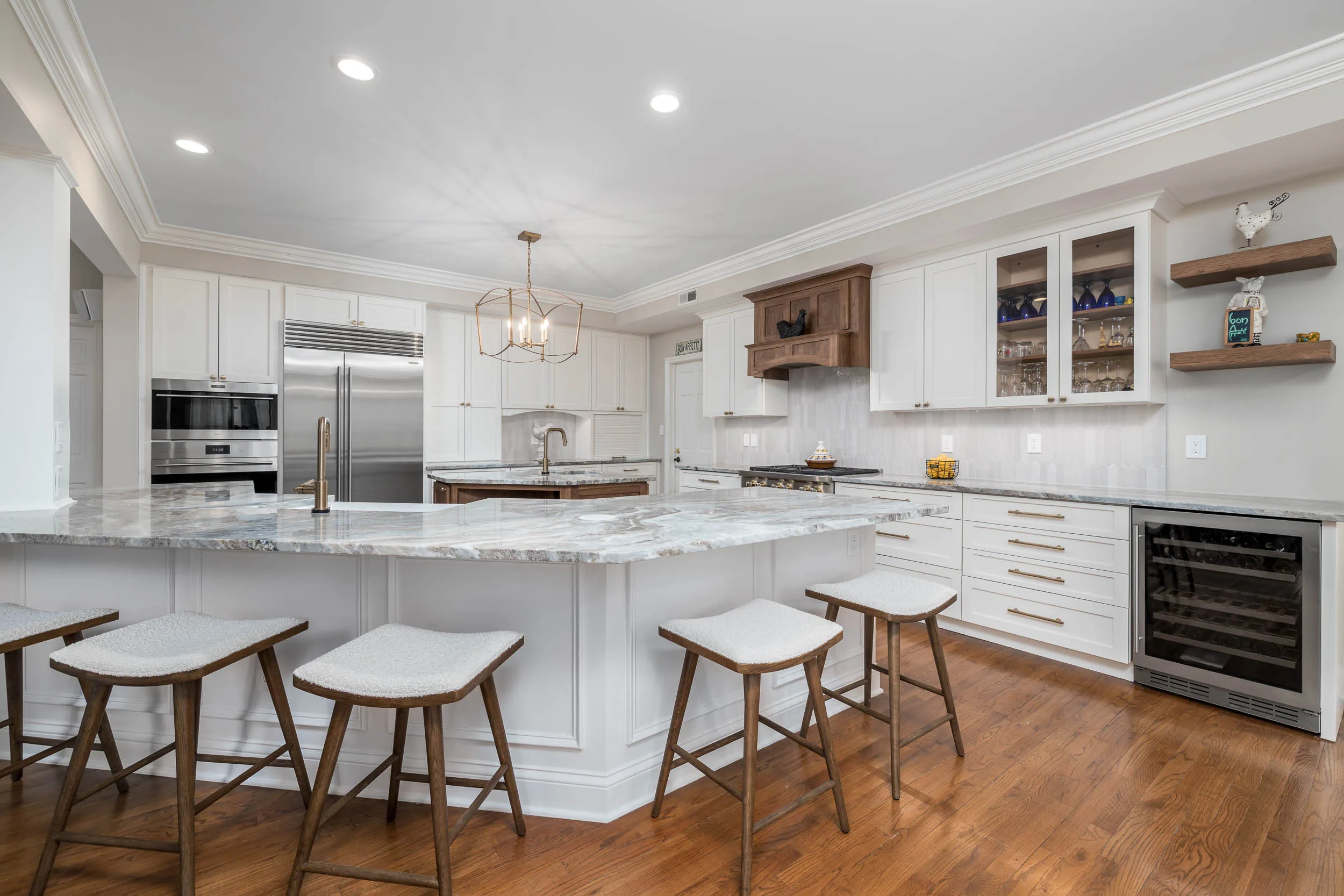 White kitchen with a walnut island, open shelving and counter stools near Pittsburgh