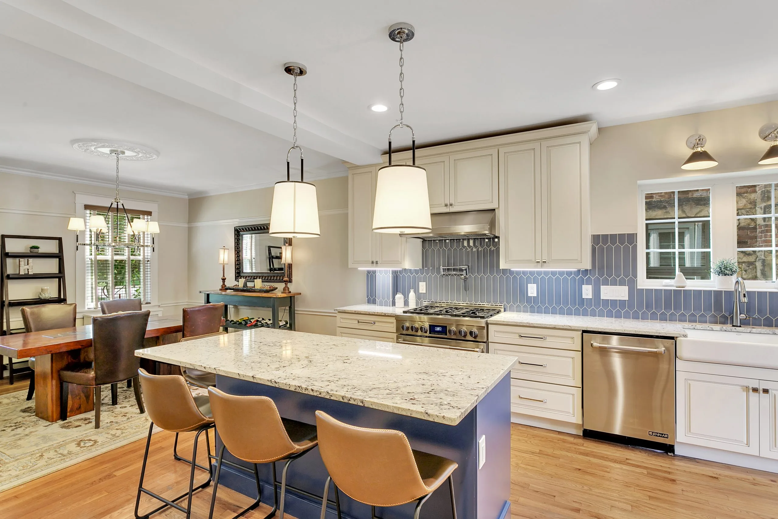 What a full-gut kitchen remodel cost in Pittsburgh delivers — an open-concept kitchen and great room with built-in shelving in Point Breeze