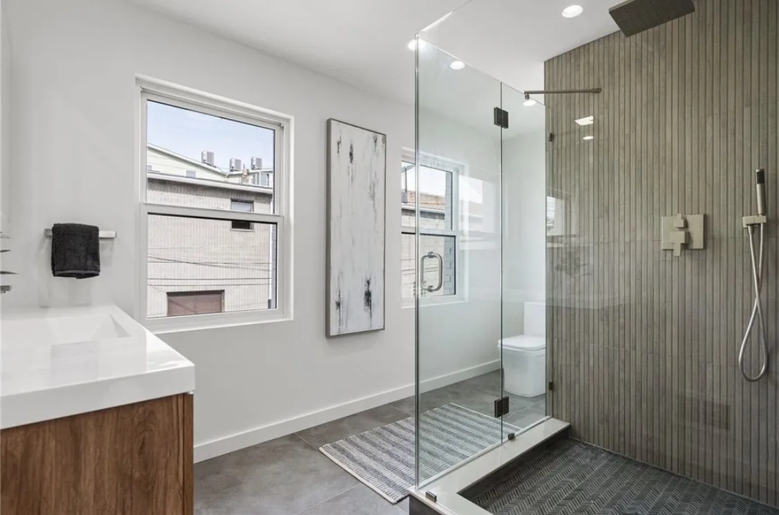 Pittsburgh bathroom remodel with a tiled walk-in shower and modern vanity