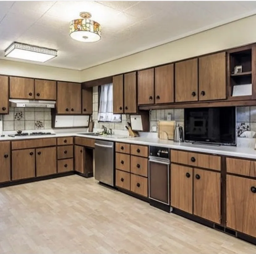 Dated Pittsburgh kitchen with worn wood-laminate cabinets before remodeling