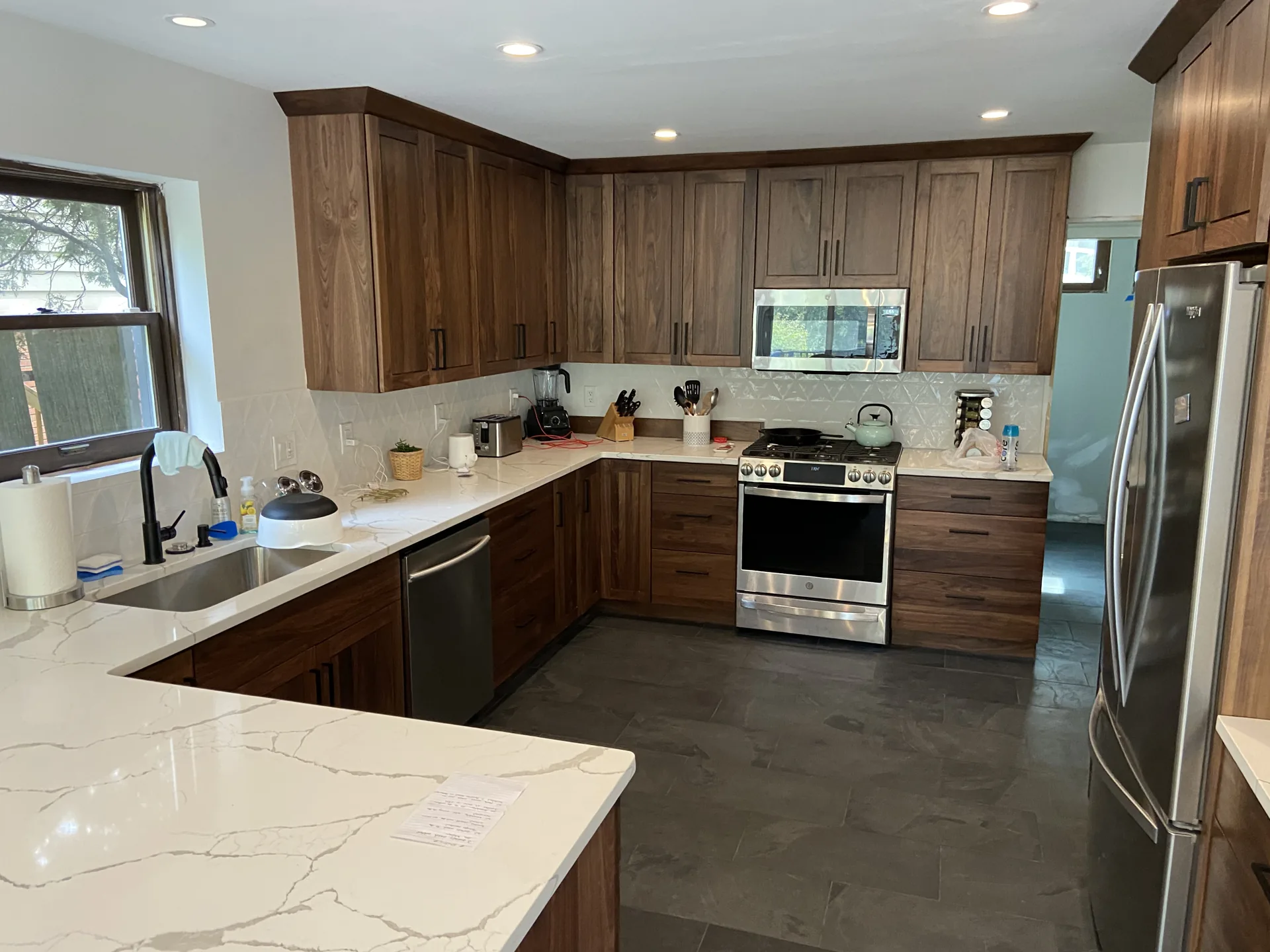 Modern Pittsburgh kitchen remodel with walnut cabinets and quartz countertops